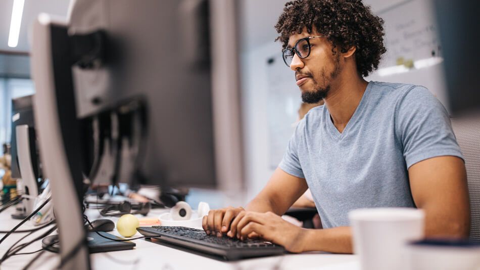 Man typing on computer